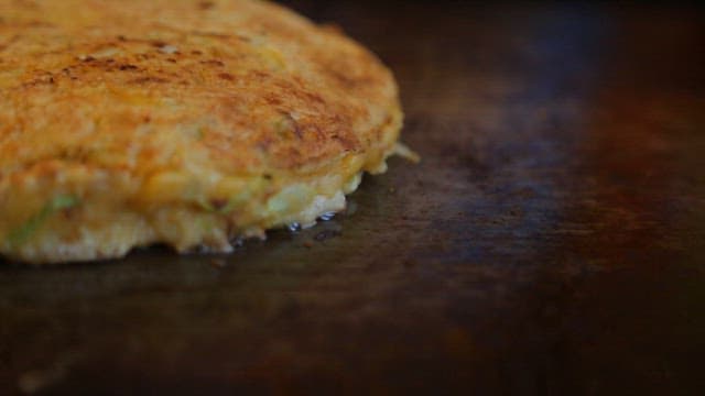 Okonomiyaki Cooked Deliciously on an Iron Plate