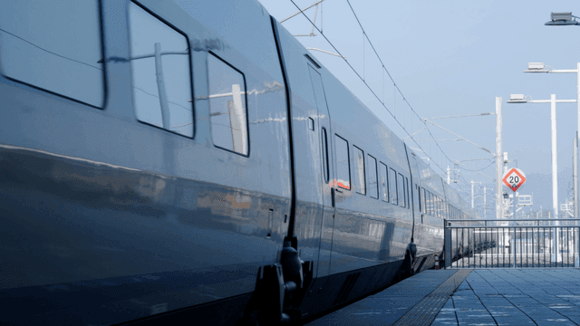 A high-speed train at a station platform