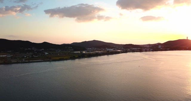 Sunset over a tranquil coastal landscape