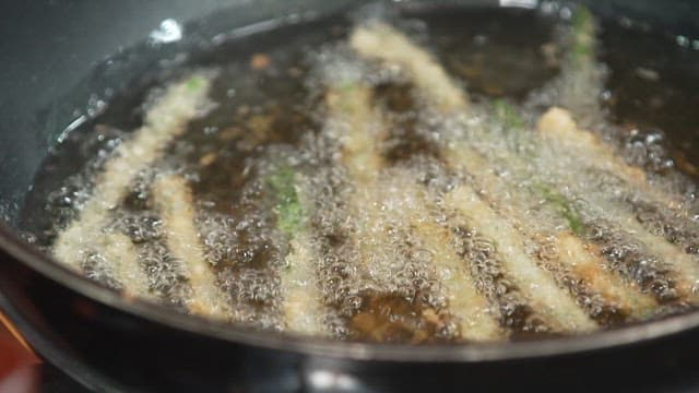 Frying Breadcrumbed Asparagus in Oil