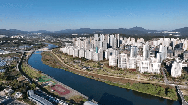 Cityscape with high-rise buildings and tranquil lake