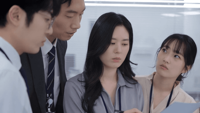 Office workers discussing a project