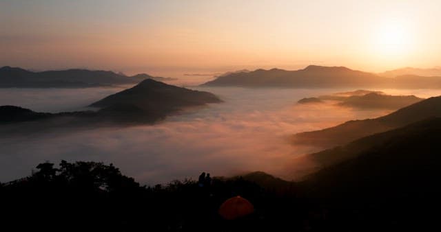 Majestic Sunrise Over Misty Mountains