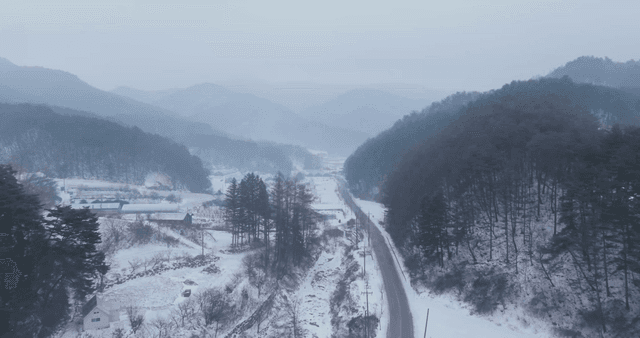 Snow-covered mountain road in winter