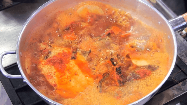 Steamed fish containing various fish simmering in a pot