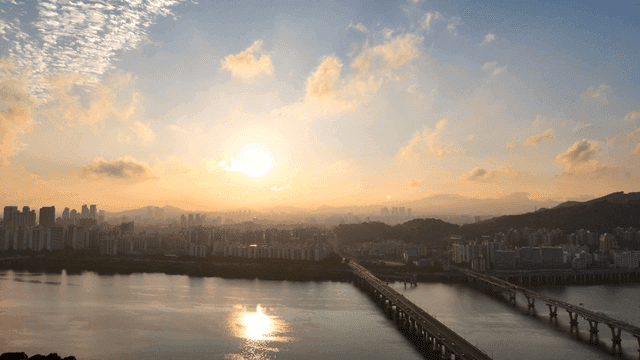 City skyline and bridge at sunrise