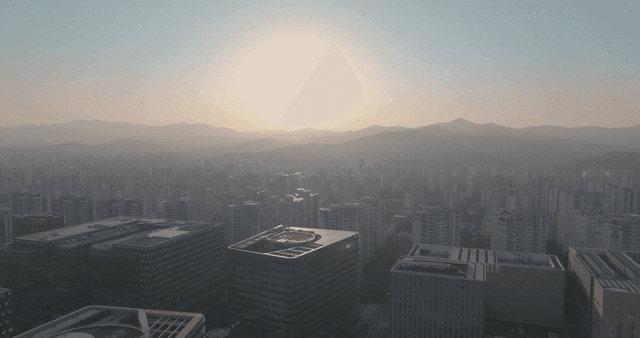 City skyline with mountains at sunrise