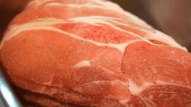 Close-up of marbled frozen raw meat
