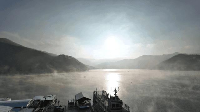 Morning sunrise, foggy lake, and mountains