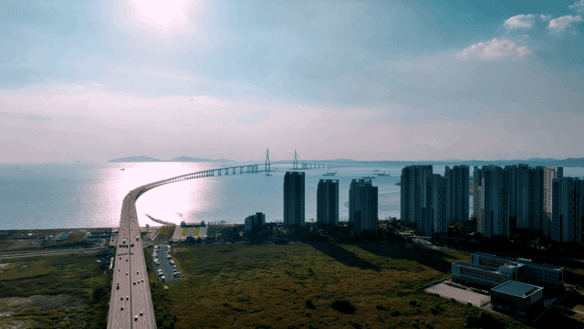 Bridge by sea and city scenery