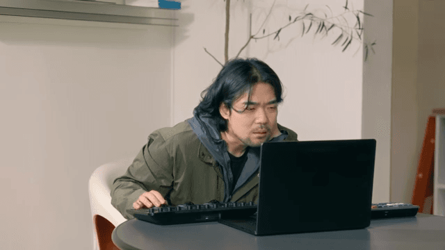 Man working on a laptop indoors