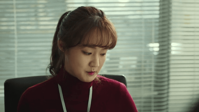 Woman with a tense expression in the office