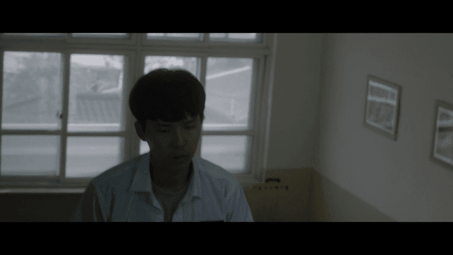 Student walking in school hallway and stairs