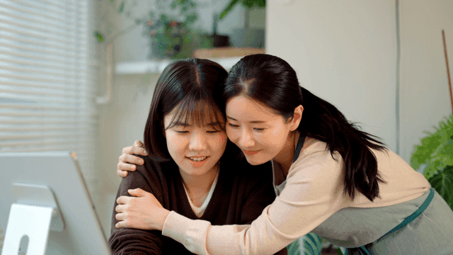 Mother and daughter hugging warmly