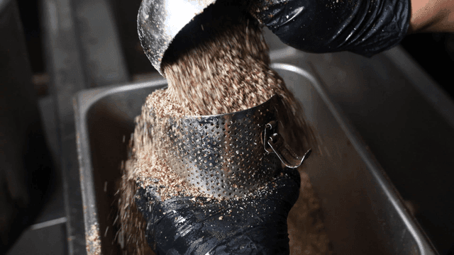 Perilla powder poured into metal sieve