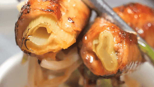 Grilled beef intestines wrapped around vegetables