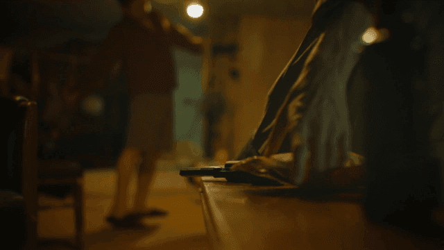 Man who puts down his gun and picks up snack