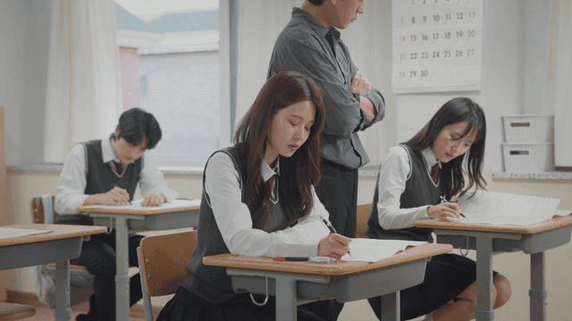Students taking an exam in a classroom