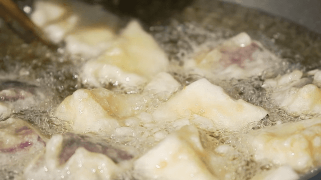 Eggplant frying in hot oil