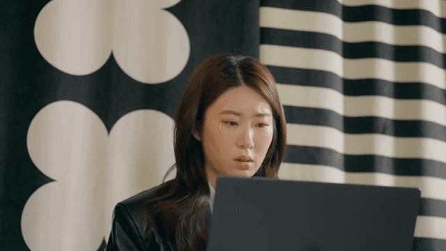 Woman focused on her laptop screen