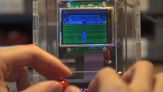 Playing a portable soccer game console