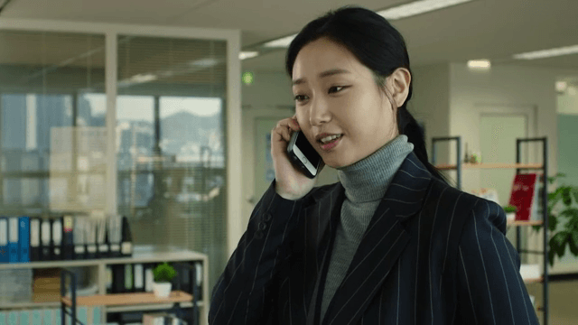 Woman in an office talking on the phone
