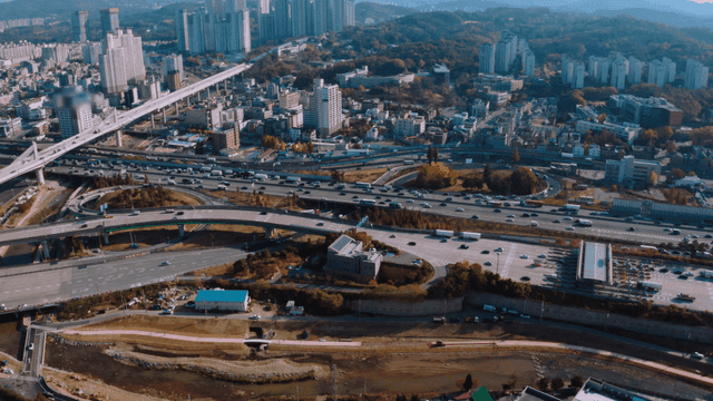 A bustling city with highways and buildings