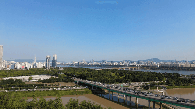 Bustling city with river and bridge
