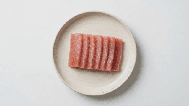 Fresh tuna sashimi served on white plate
