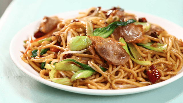 Plate of noodles stir-fried with vegetables