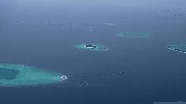 Islands surrounded by clear blue ocean