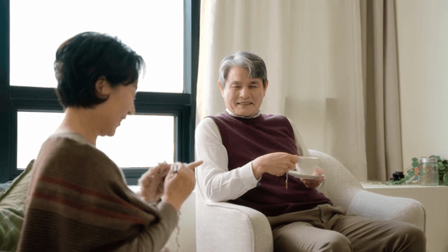 Elderly couple relaxing in a cozy living room