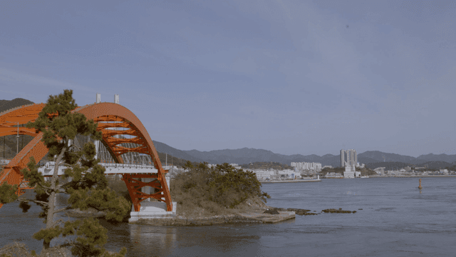 Orange bridge over calm sea