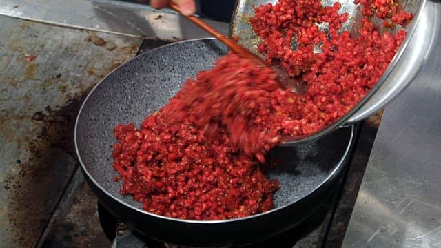 Ground beef being cooked in a pan