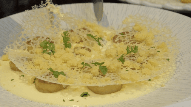 Gourmet gnocchi with cream sauce and herbs