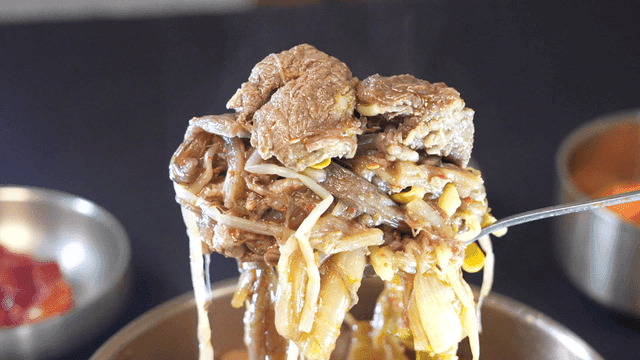 Korean beef soup filled with meat in spoon
