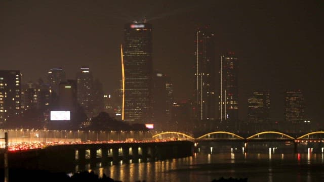 Buildings and Bridges Lit Up at Night