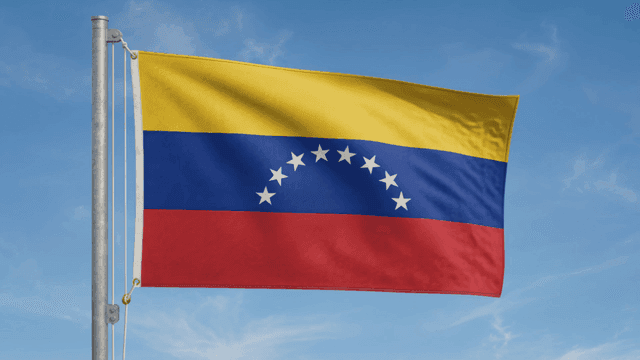 Venezuelan flag waving in the sky