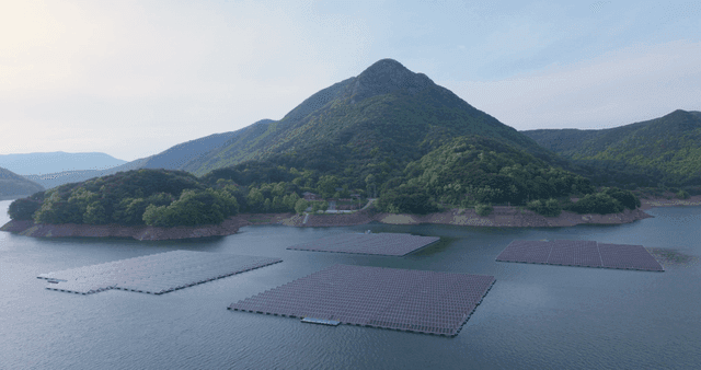 Floating solar panels on a serene lake