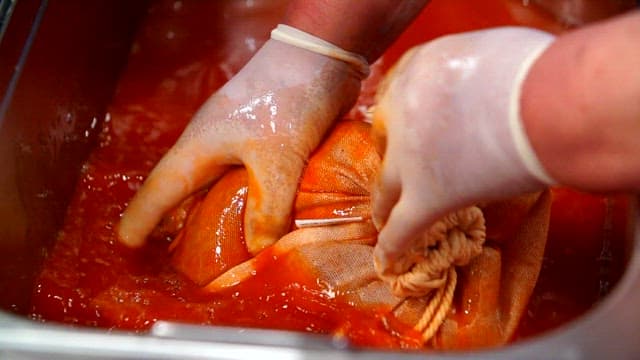 Preparing kimchi in a red sauce