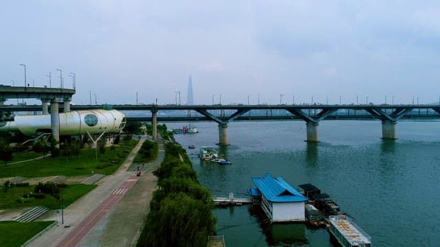 Cityscape with Bridge Over River and Buildings