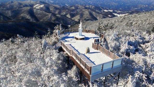 Observation deck on top of a white snow-covered mountain and magnificent view