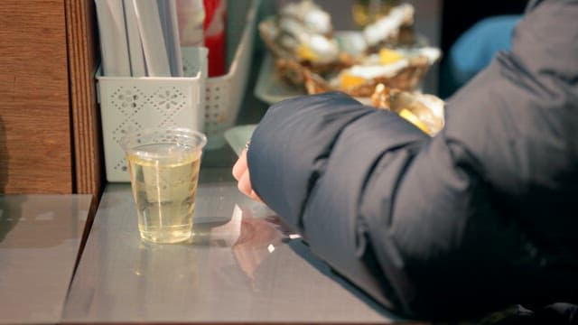 People enjoying fresh oysters with lemon