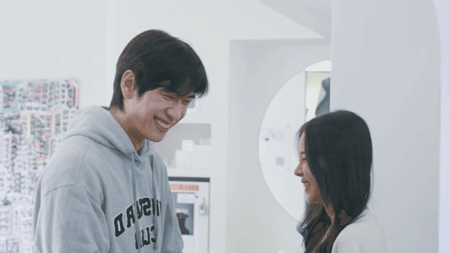 Happy couple smiling at a four-cut photo studio