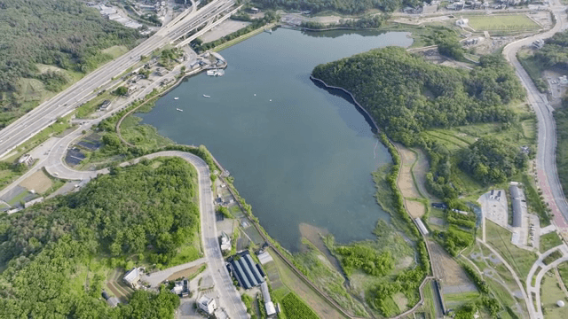Aerial view of a lake surrounded by roads