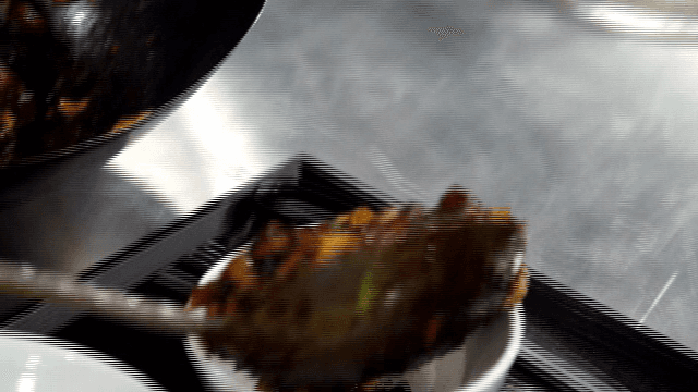 Black Bean Sauce being served into a bowl
