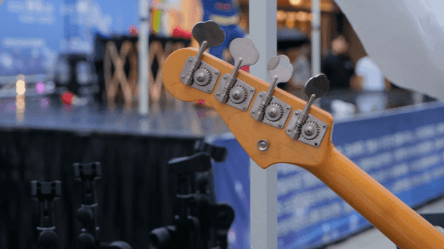 Guitar headstock at a live performance