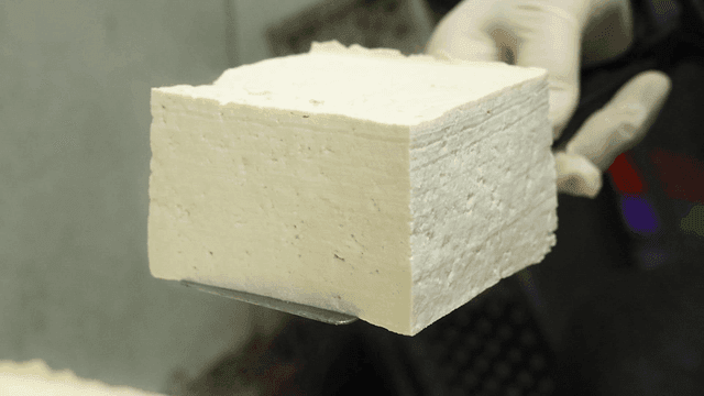 Freshly made tofu, handled with care