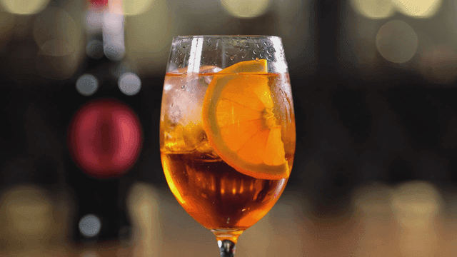 Refreshing cocktail with orange slice