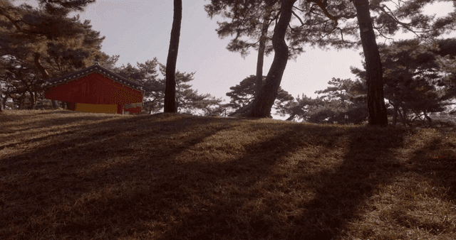 A serene forest with a traditional building